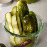 fermented pickles in a weck jar with a red hot pepper.