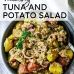 A gray bowl filled with tuna potato salad.
