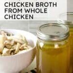 A bowl of boiled chicken with chicken broth in two clear jars.