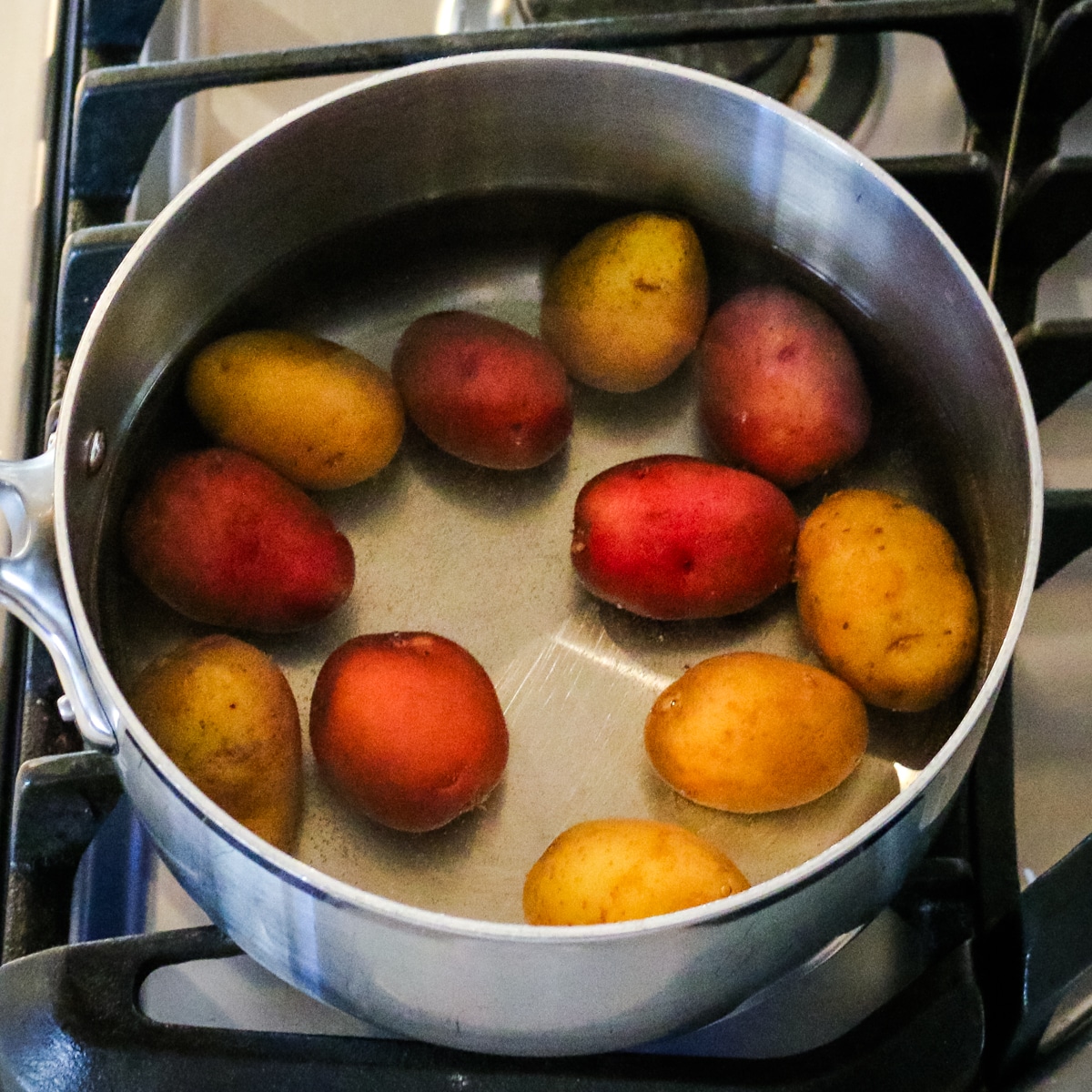 Potatoes with water in a pan.