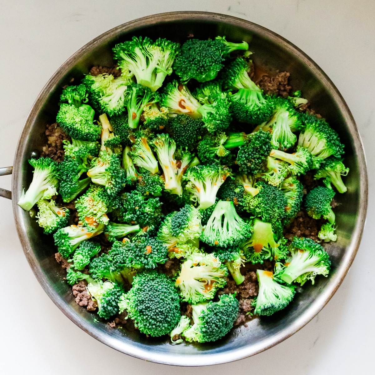 Ground beef and broccoli in a pan