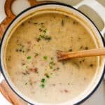 Bacon, mushroom, and potato soup in a pot.