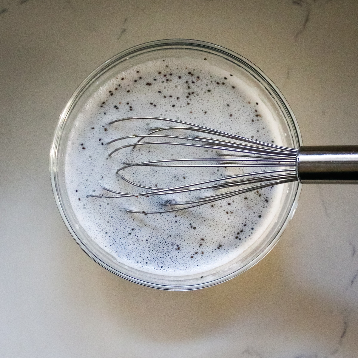 Mix the pudding with chia seeds using a whisk.
