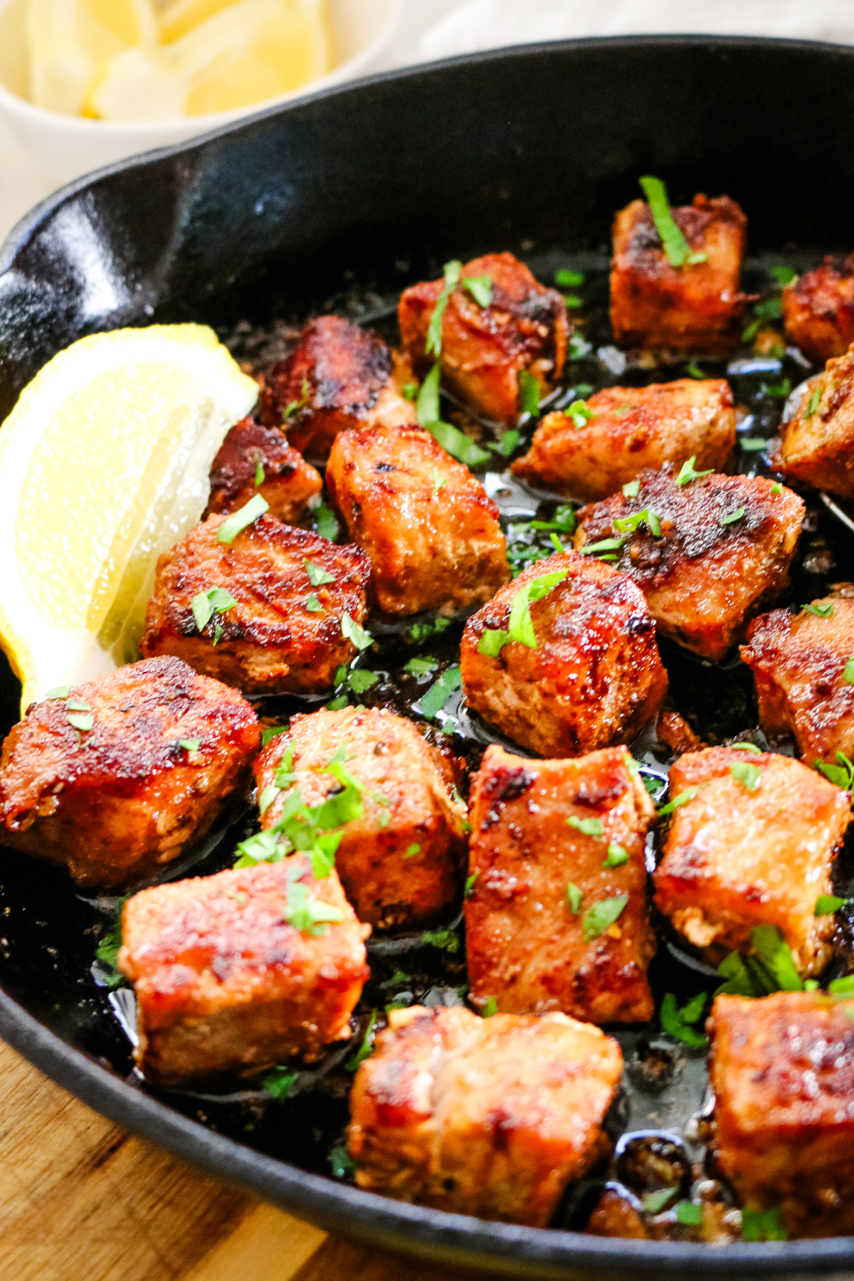 pork bites in cast iron skillet.