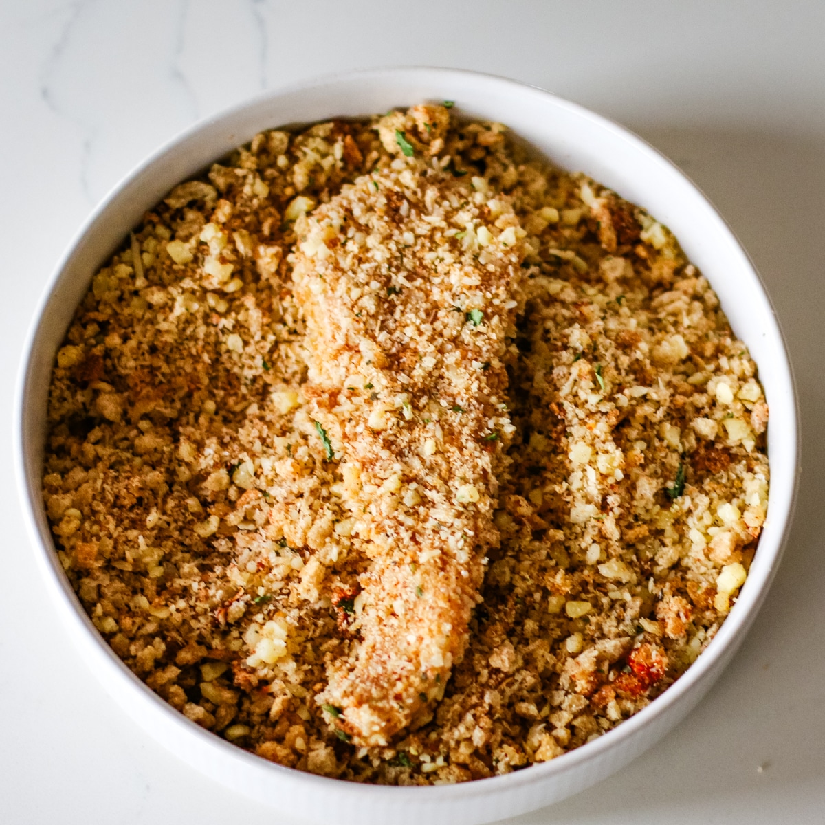 chicken cutlets coated in crumbs.