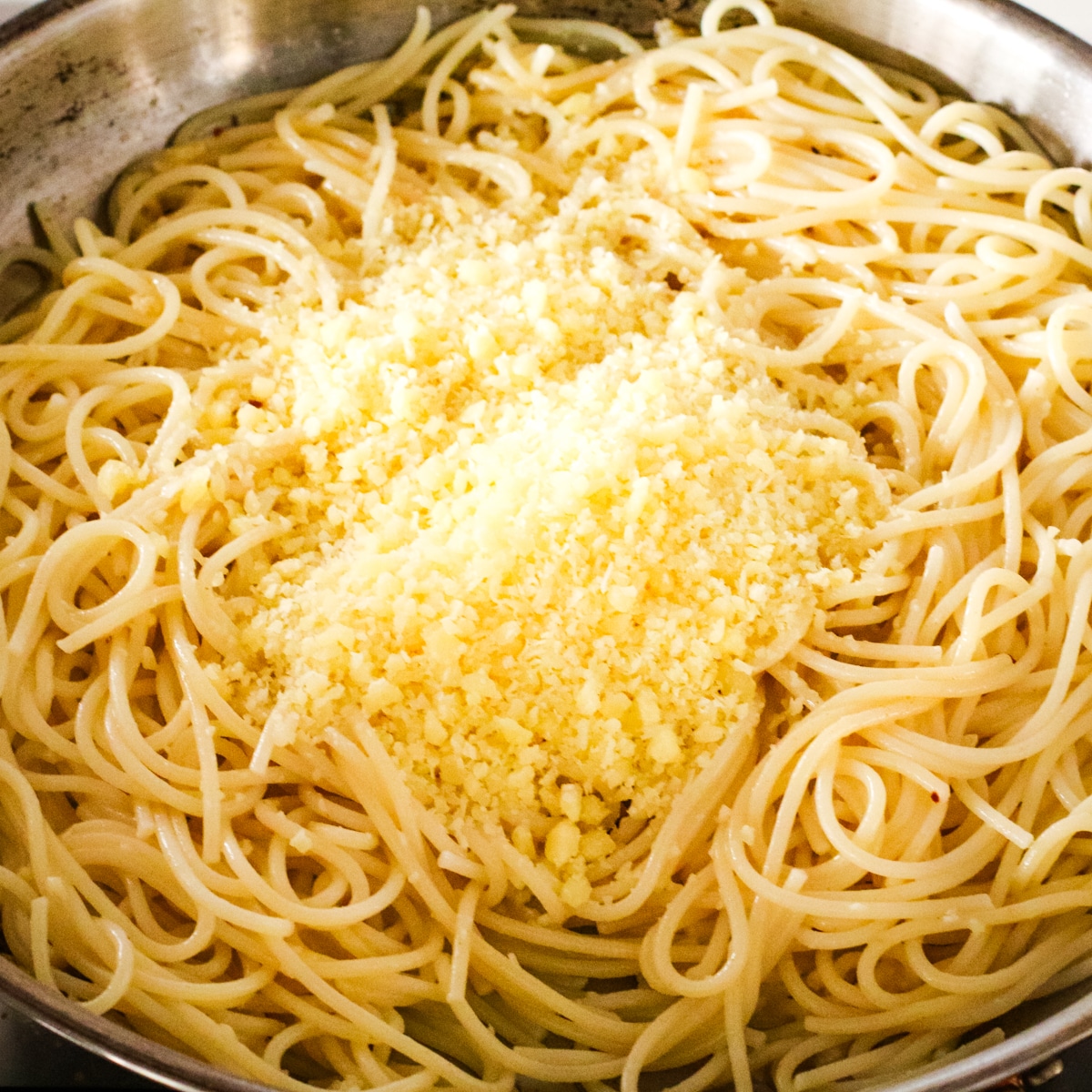 pasta with cheese in a pan.