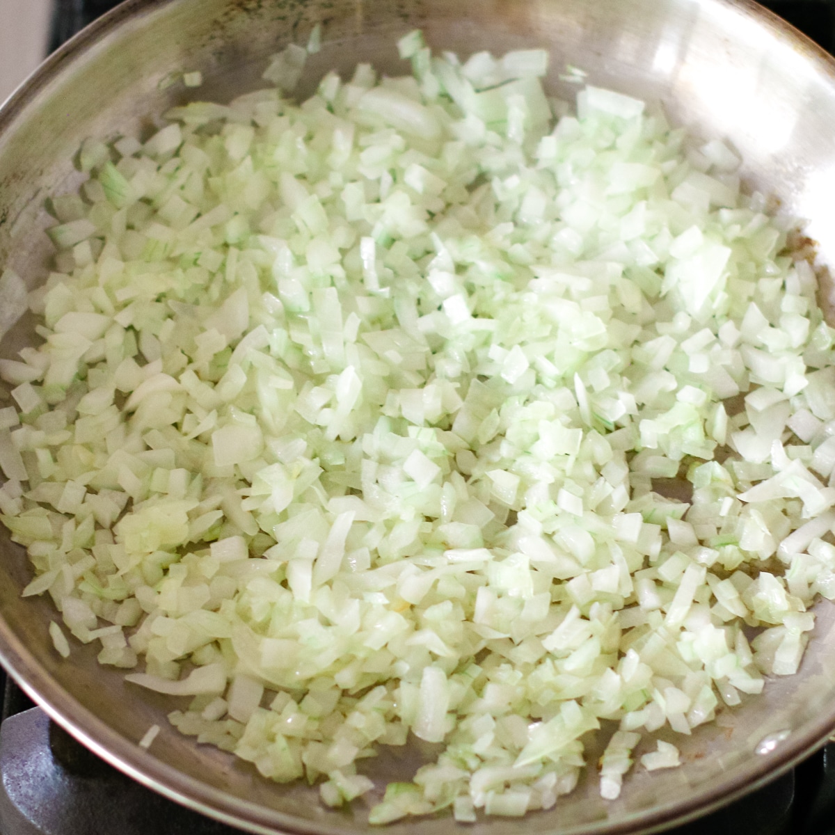 sautéing onions in a pan.