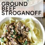 pasta with ground beef stroganoff in a small bowl topped with herbs.