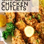 crispy oven-baked chicken cutlets on a plate.