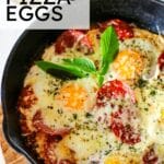pizza egg on a pan topped with herbs.