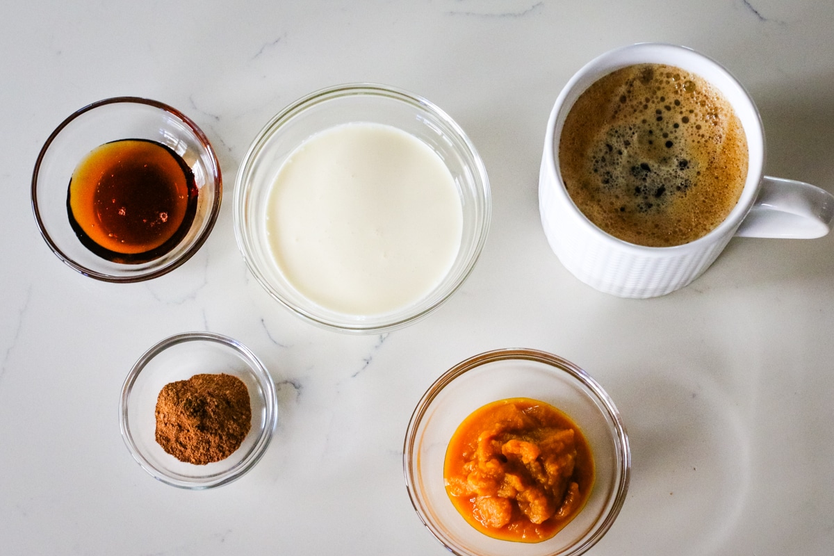 ingredients for making a pumpkin spice latte.