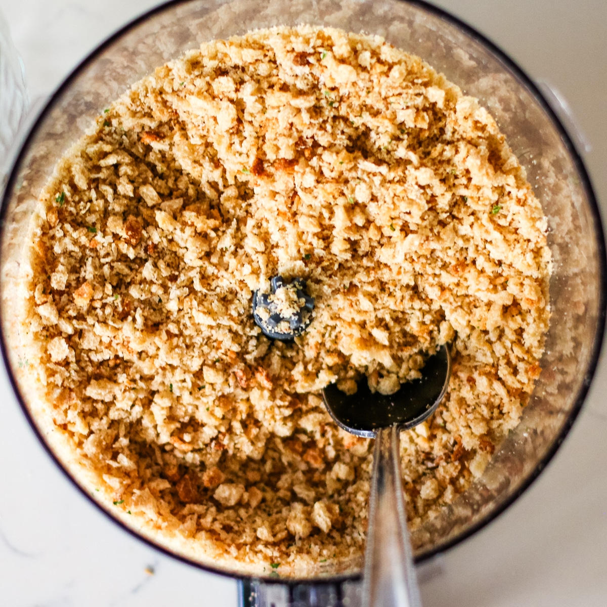 breadcrumbs on a blender and a spoon.