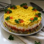 layered mimosa salad with tuna and egg.