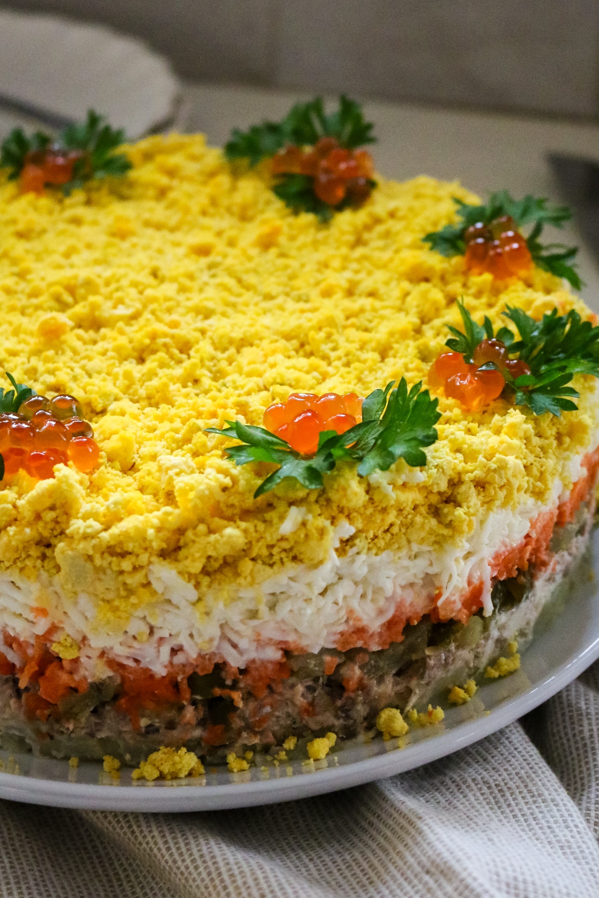 layered mimosa salad with tuna and egg.