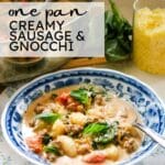 creamy sausage in a bowl with pan in the back ground.