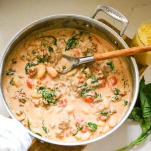 creamy sausage and gnocchi in a pan.