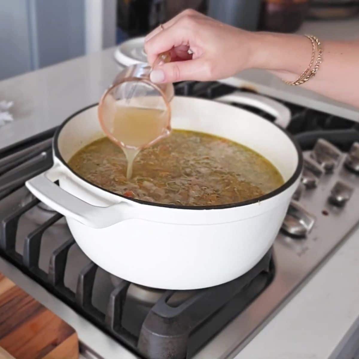 Shredded chicken added back into the pot to warm through.
