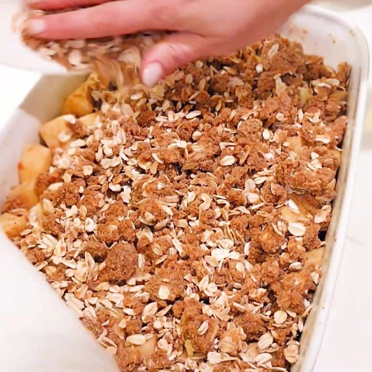 Sprouted oats stirred in and crumble topping evenly spread over the apple filling.