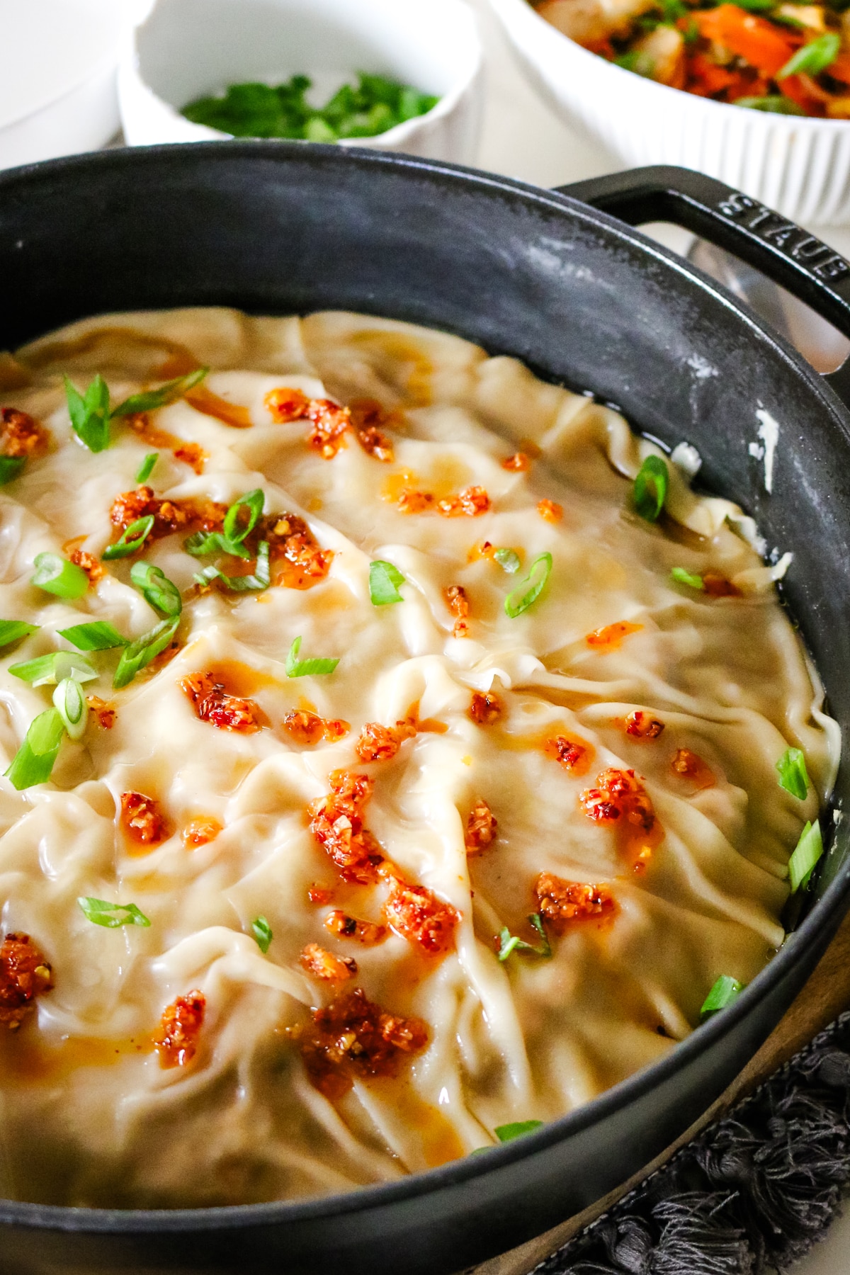 dumpling lasagna in a chistera saute pan.