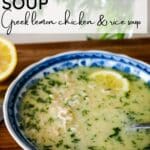 Avgolemono soup with lemon and shredded chicken, served with a spoon.