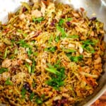 step 2 of egg roll in a bowl in a large wok.