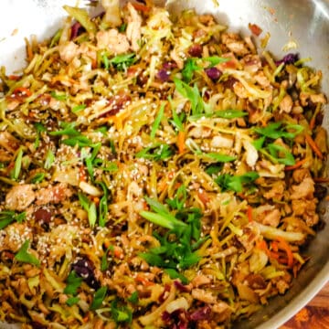 step 2 of egg roll in a bowl in a large wok.