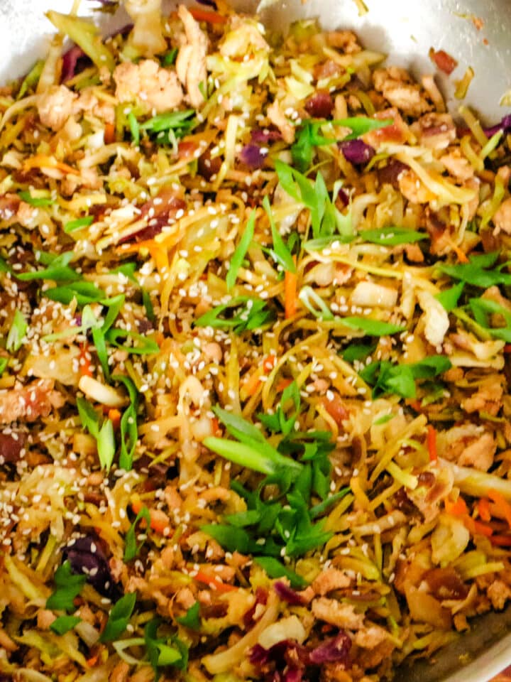 step 2 of egg roll in a bowl in a large wok.