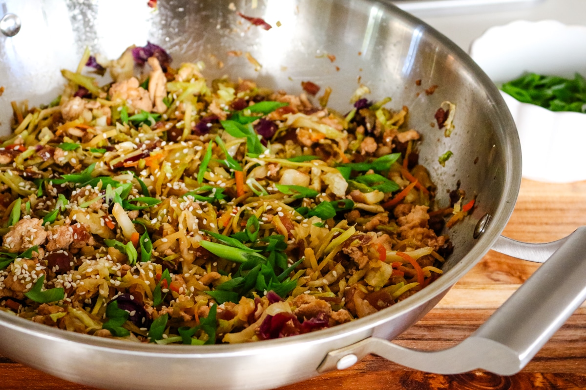egg roll in a bowl in a work on a wooden board.