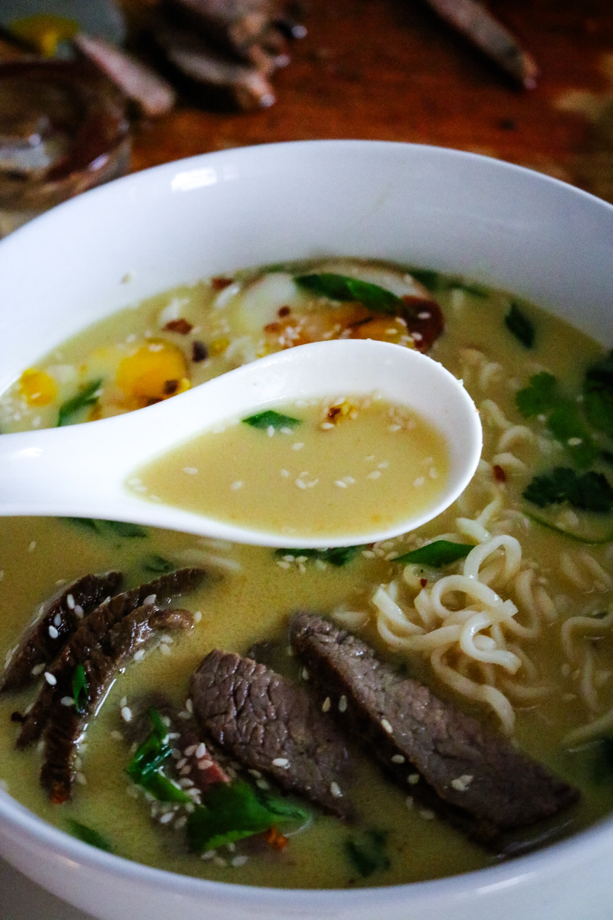 creamy steak ramen with noodles and greens.