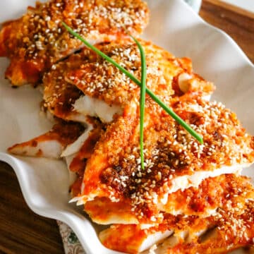 flakey white fish with sesame seeds and panko breadcrumbs.