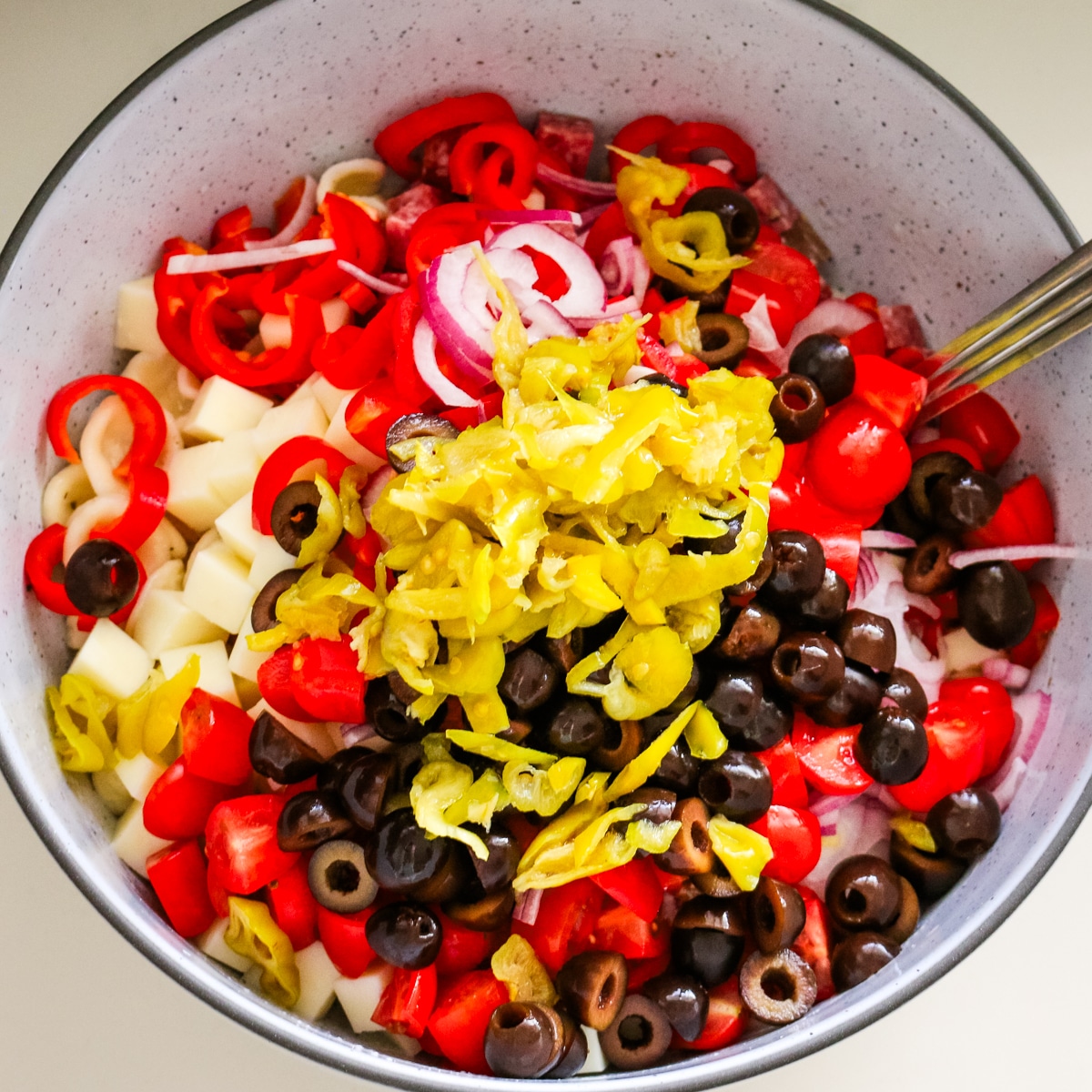 italian pasta salad in a white bowl.