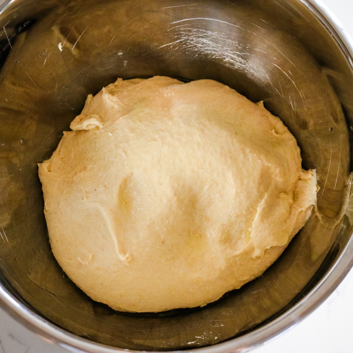 dough for pigs in a blanket in a metal bowl.