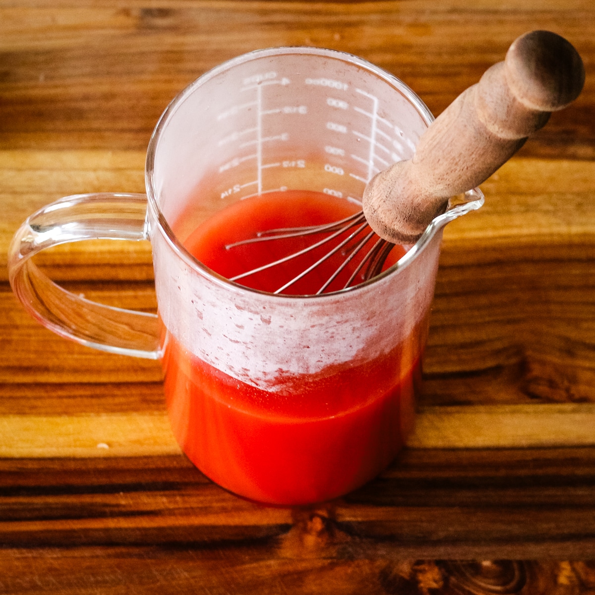 tomato paste diluted with water to make a liquid to smother bell peppers.