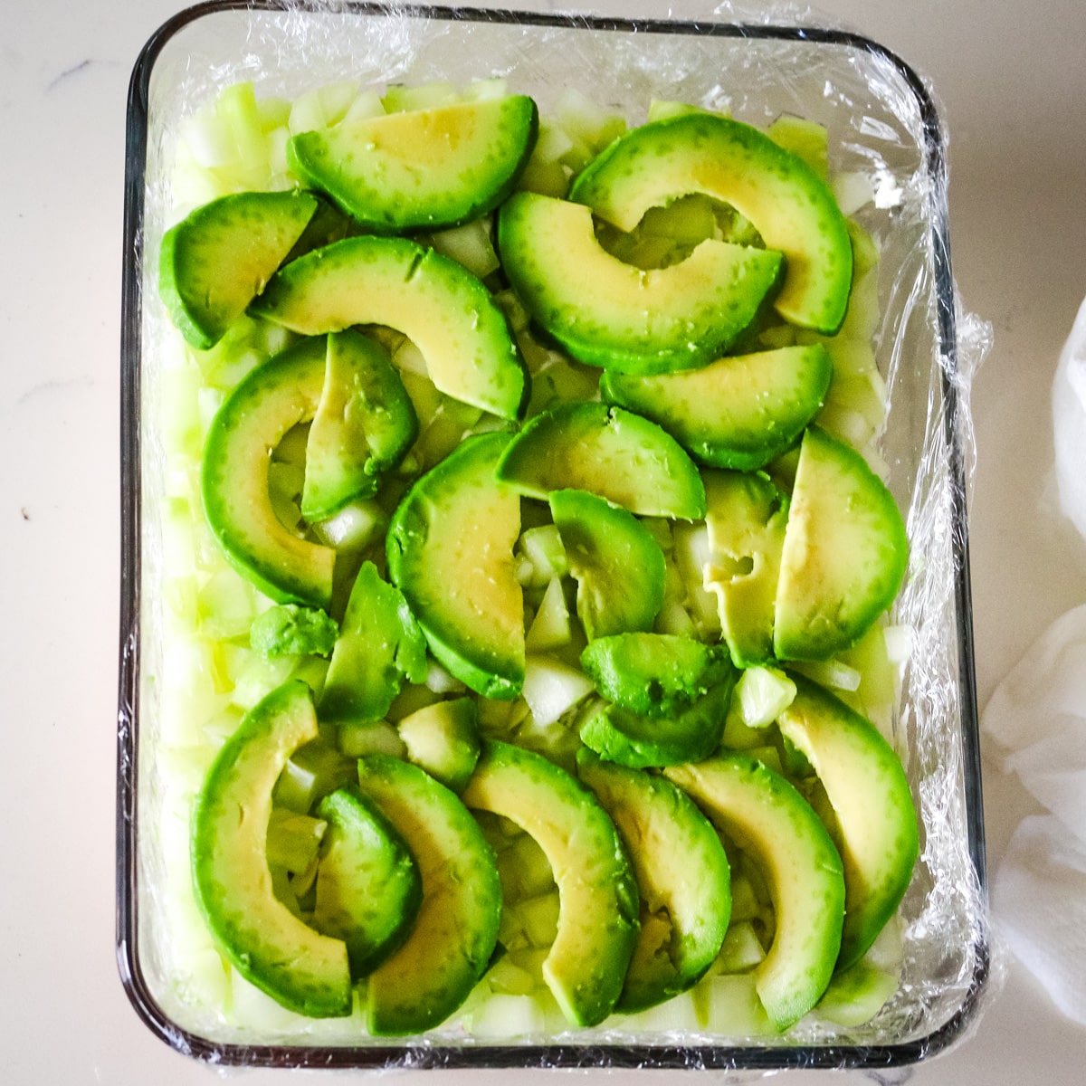avacado and cumbers on top of rice.