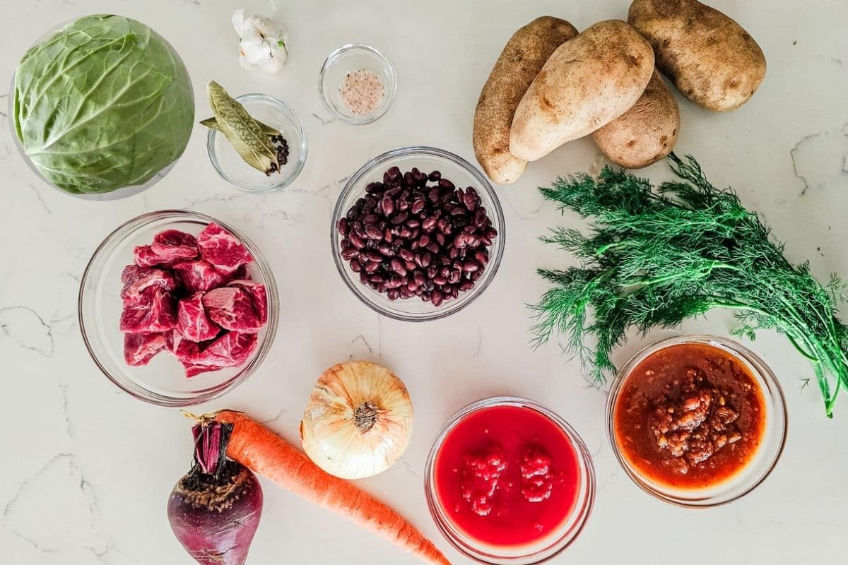 borsh ingredients like dill, cabbage, potatoes, beans, and beef.